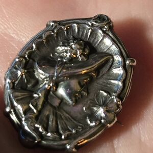Antique Silver Brooch with Intricate Floral Design